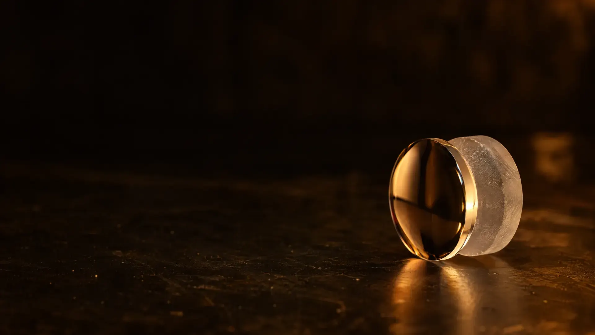 A thick lens blank showing its glossy molded front and its rough unfinished back.