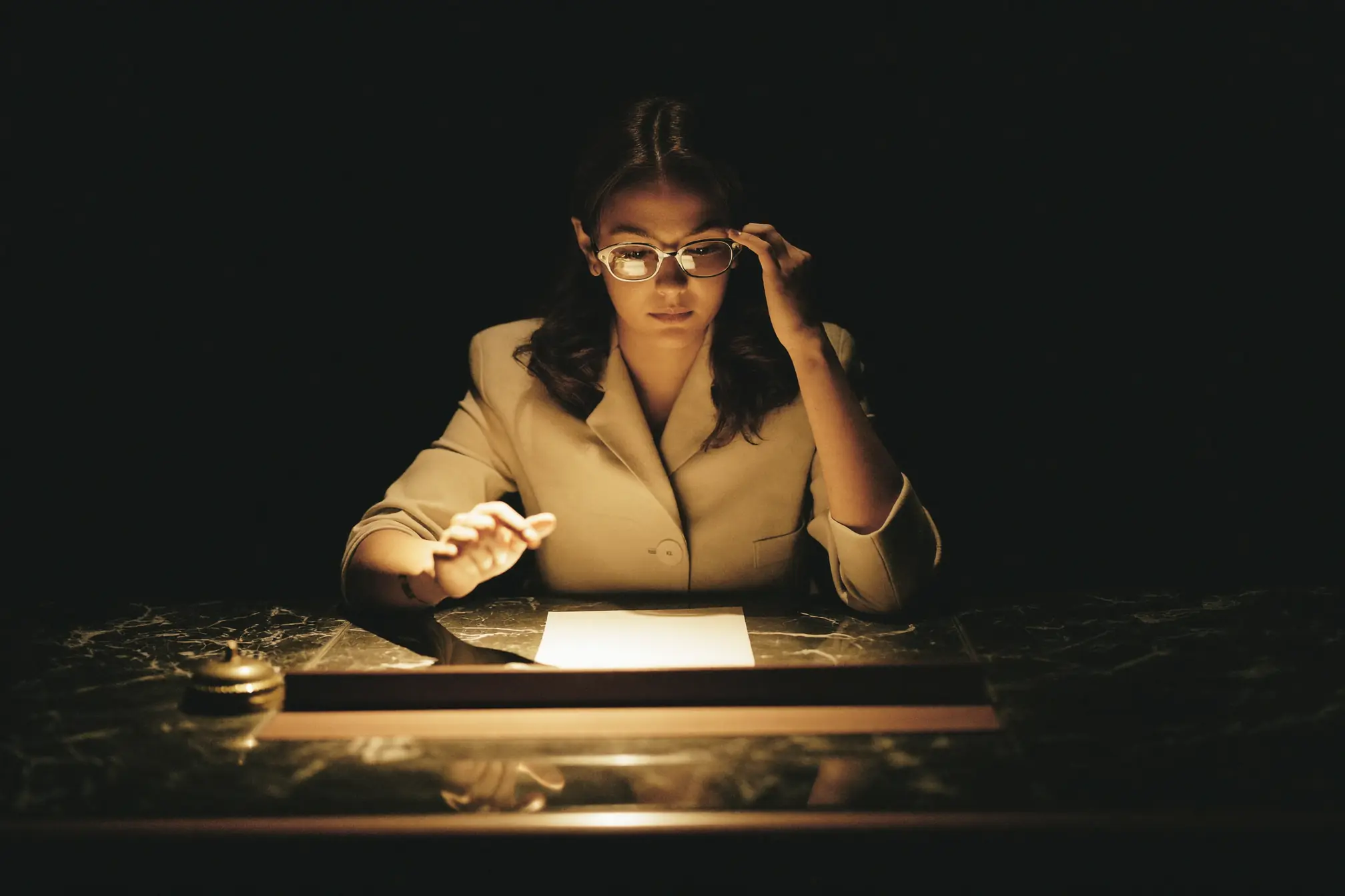 A hotel front desk manager at their work.